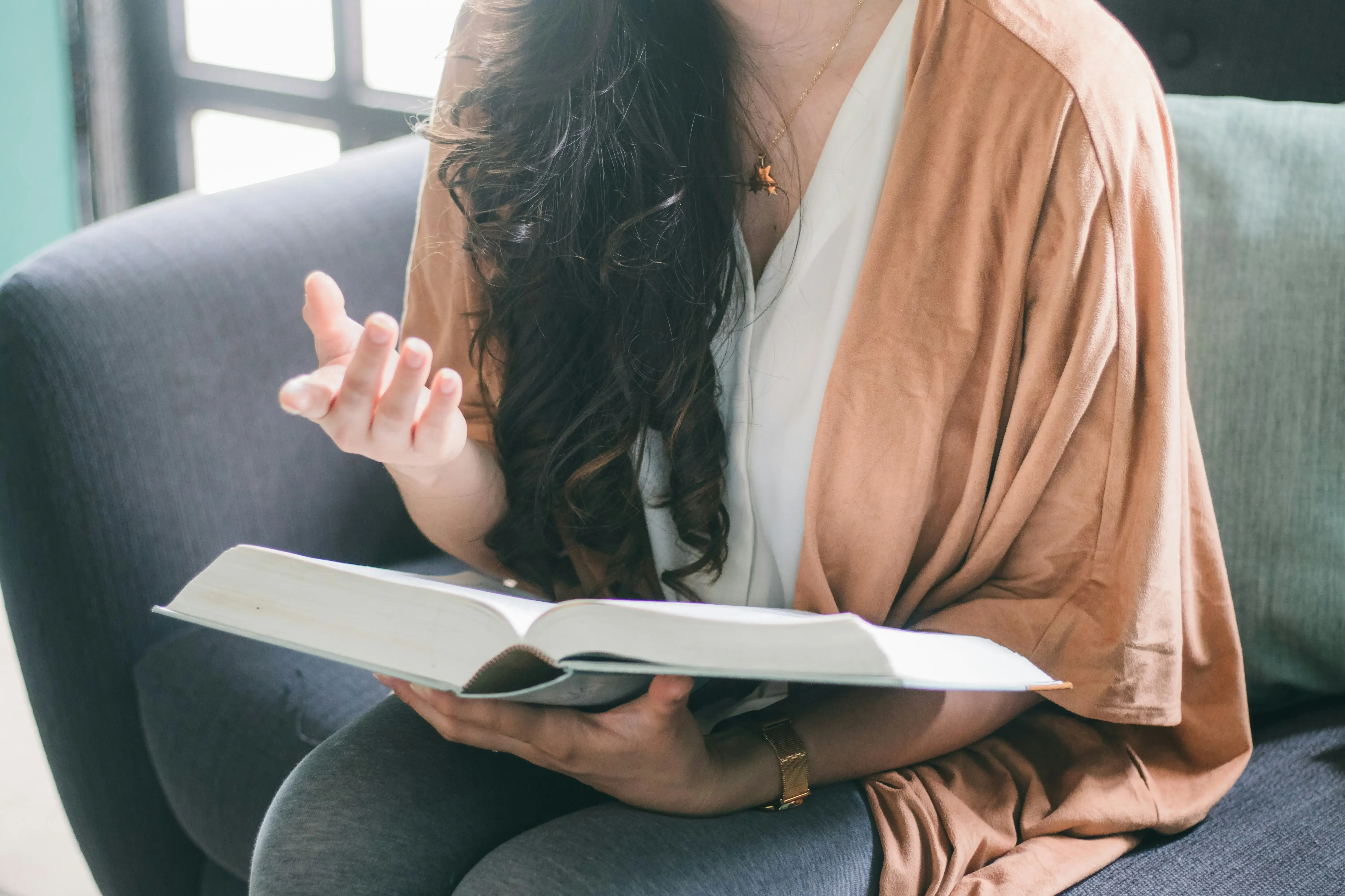 A woman holding a textbook